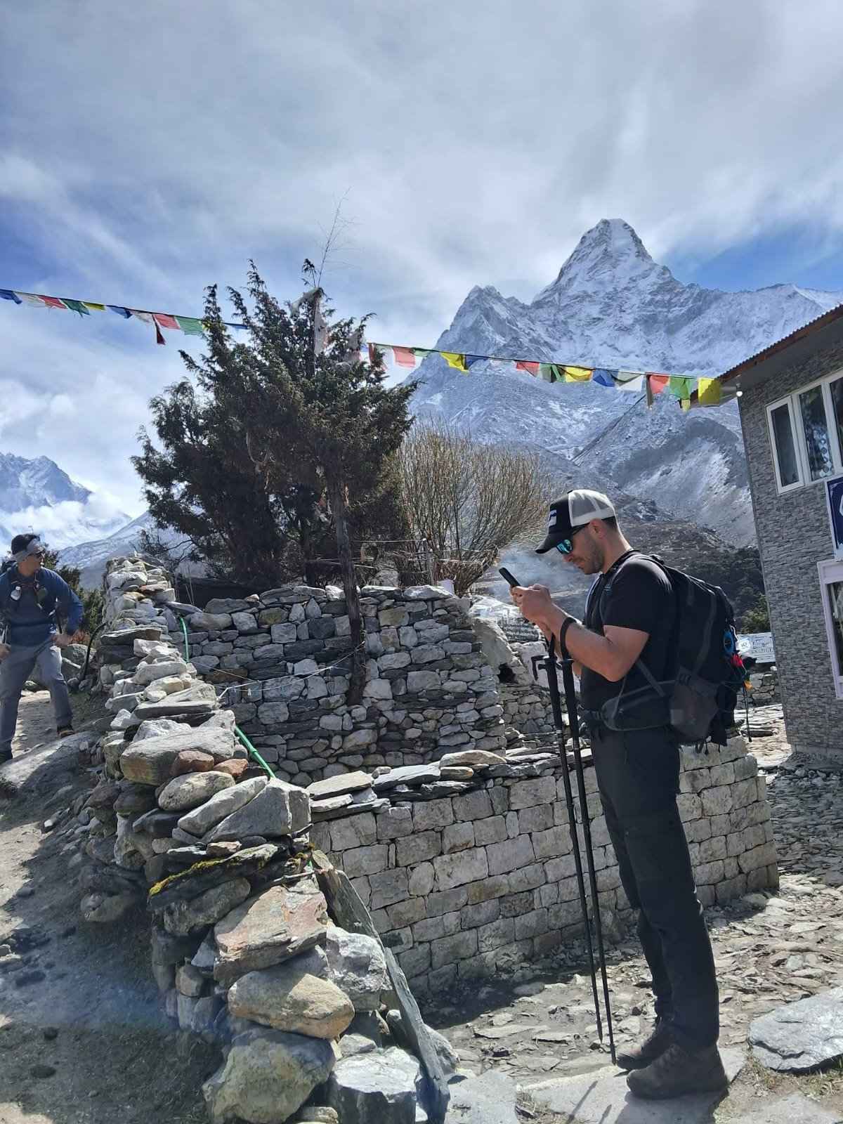 Everest Base Camp trek by road: trekkers admiring Ama Dablam in the Khumbu region of Nepal