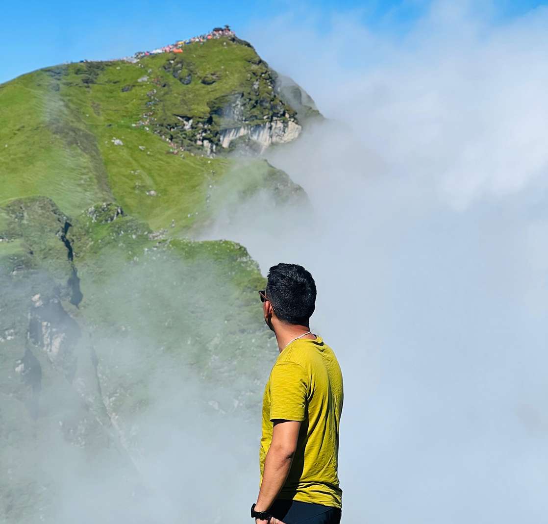 Traveler enjoying scenic views of Badimalika Temple and Himalayan landscape in Bajura, Nepal