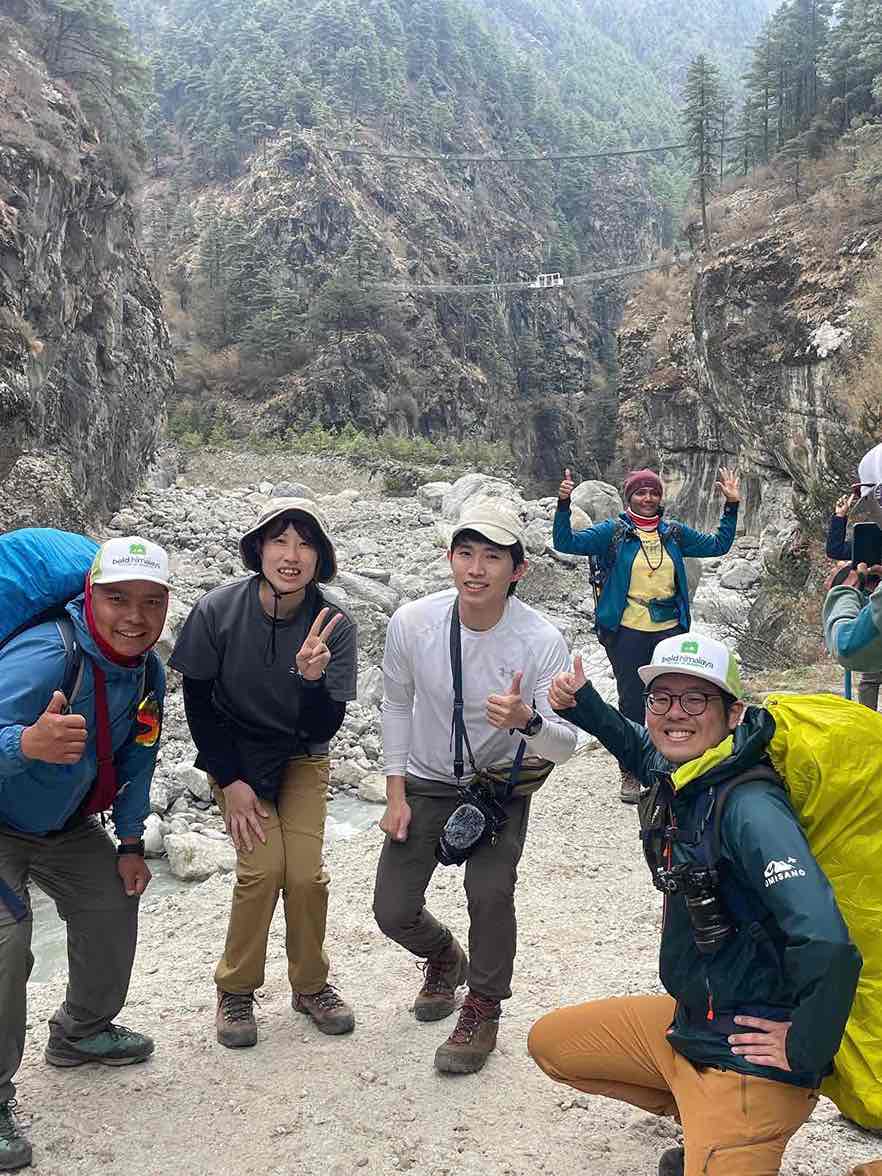 Group of trekkers posing near the iconic Hillary Suspension Bridge on the Everest Three Pass Trek