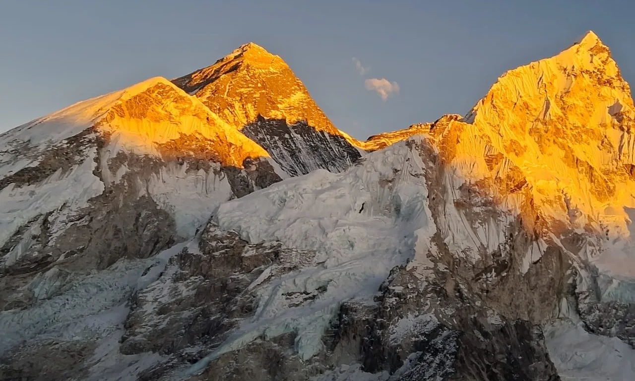 Golden Mount Everest glowing at sunset with warm golden light over the Himalayan range during Everest Base Camp Trek 15 Days