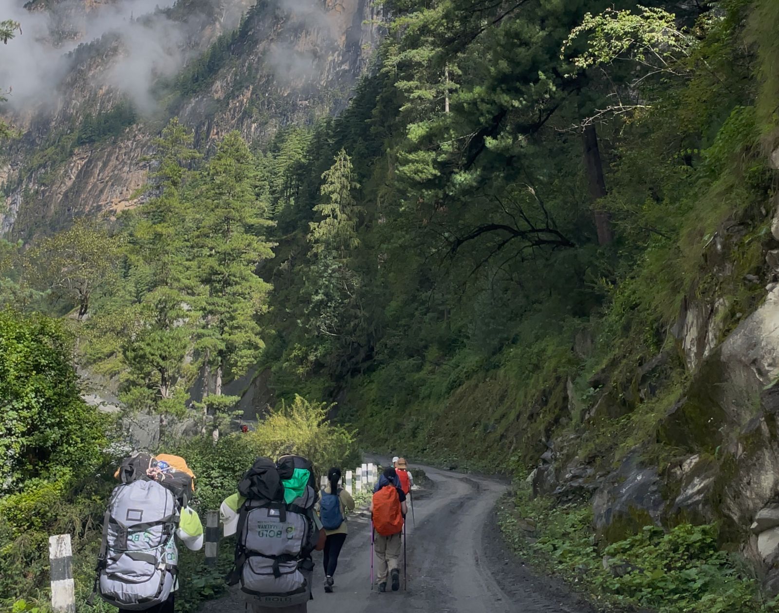 Trekking through alpine meadows on the Annapurna Circuit with Tilicho Lake”