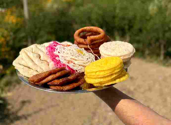 Assorted traditional Nepali rotis, including Sel Roti, during Tihar celebrations.