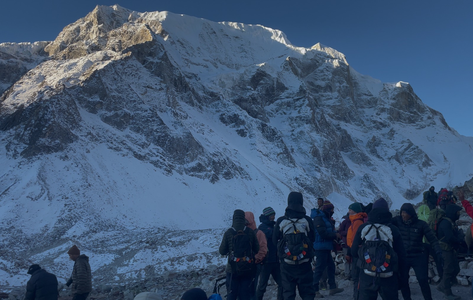 Trekking team resting on the trail to Larkya La Pass on the Manaslu Circuit Trek Larke La Pass