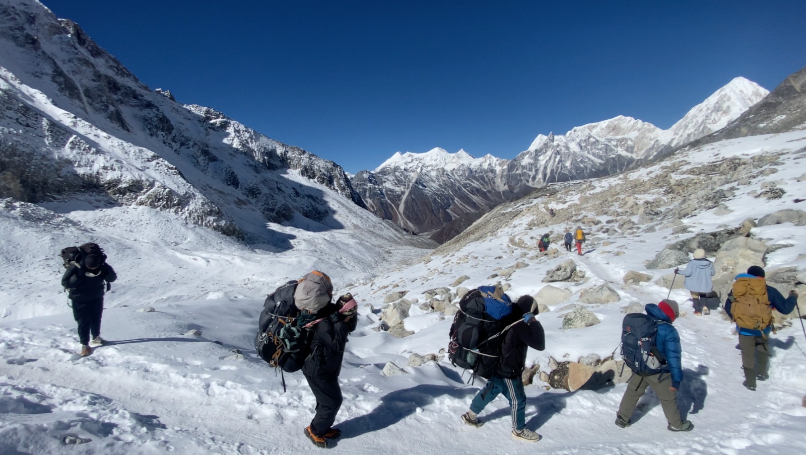 Trekkers and porters heading to Bhimthang on the Manaslu Circuit Trek Larke La Pass.