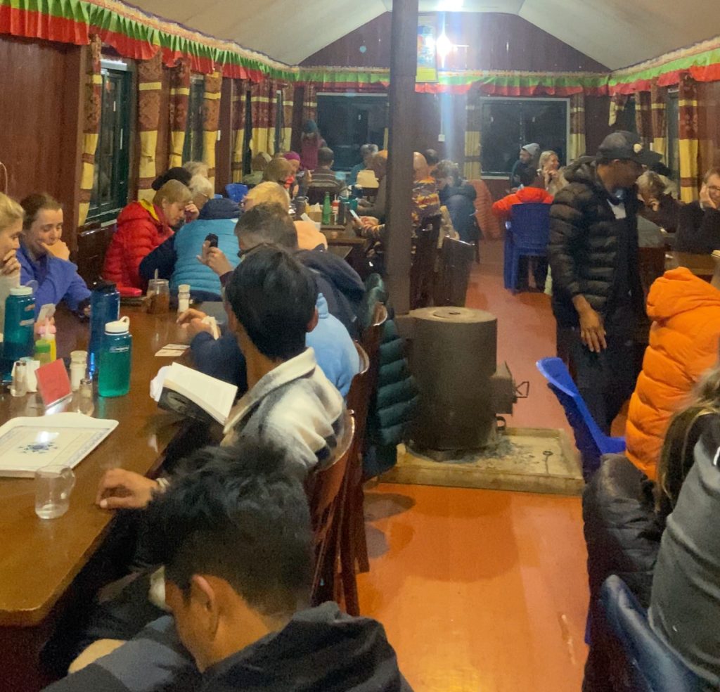 Trekkers resting at a tea house on the Manaslu Circuit Trek