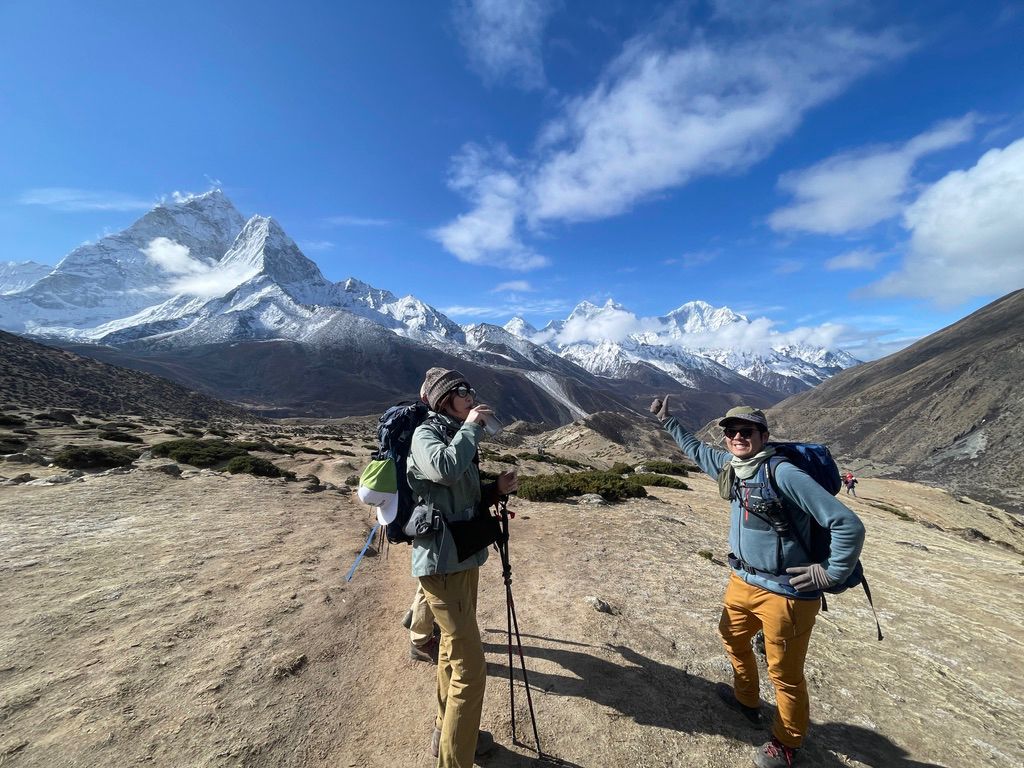 Trekkers enjoying panoramic Himalayan mountain views on Everest Base Camp trek in Sagarmatha National Park