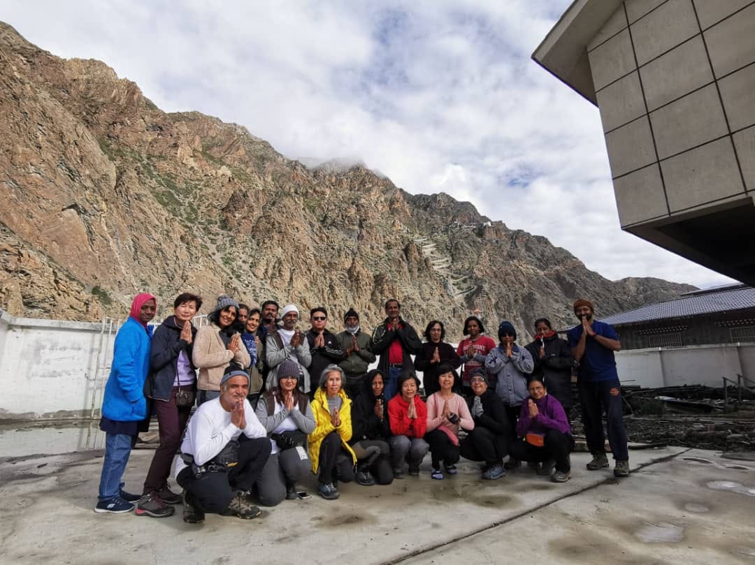 Group of international pilgrims during Kailash Yatra in Tibet, highlighting travel experience and Kailash Mansarovar Yatra cost factors-Mount Kailash Yatra Cost