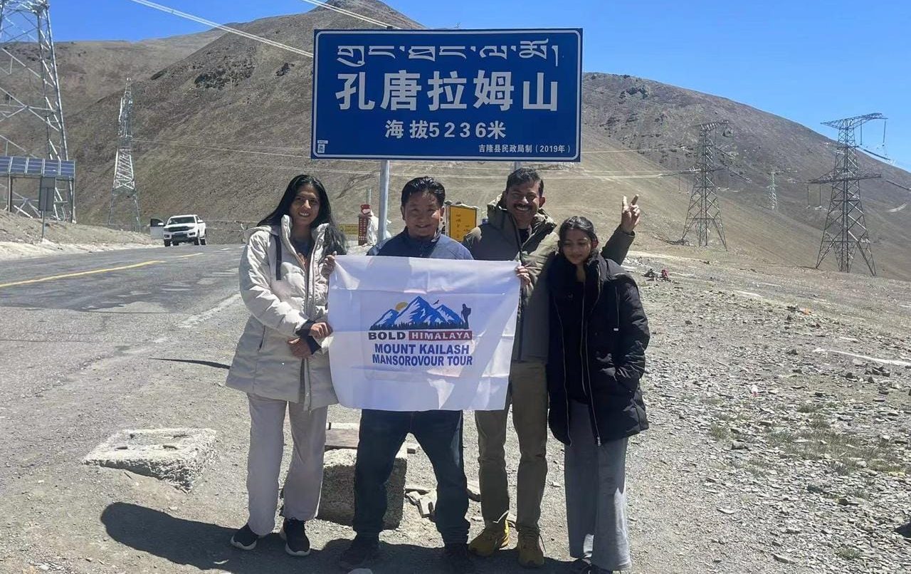 Group of pilgrims at Kora La Pass on the Kailash Yatra, highlighting the best time to visit Kailash Mansarovar with clear skies and safe travel condi-Kailash Mansarovar Yatra