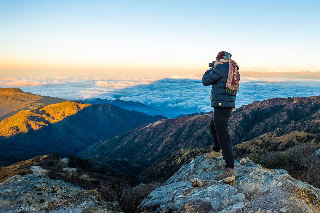photographer clicking pictures on a trek