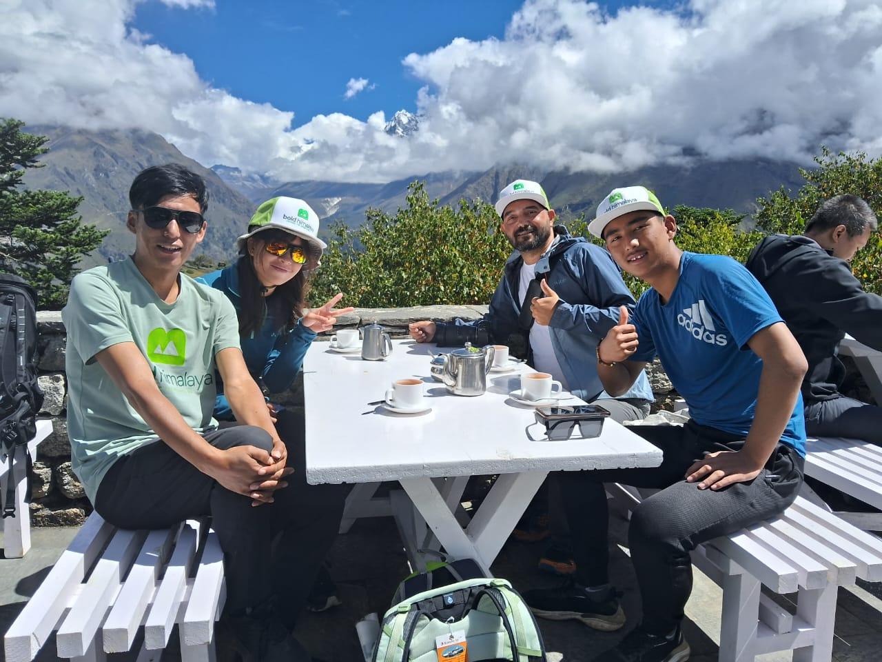 Clients enjoying breakfast at Everest View Hotel with breathtaking Himalayan views during the Everest Base Camp Trek