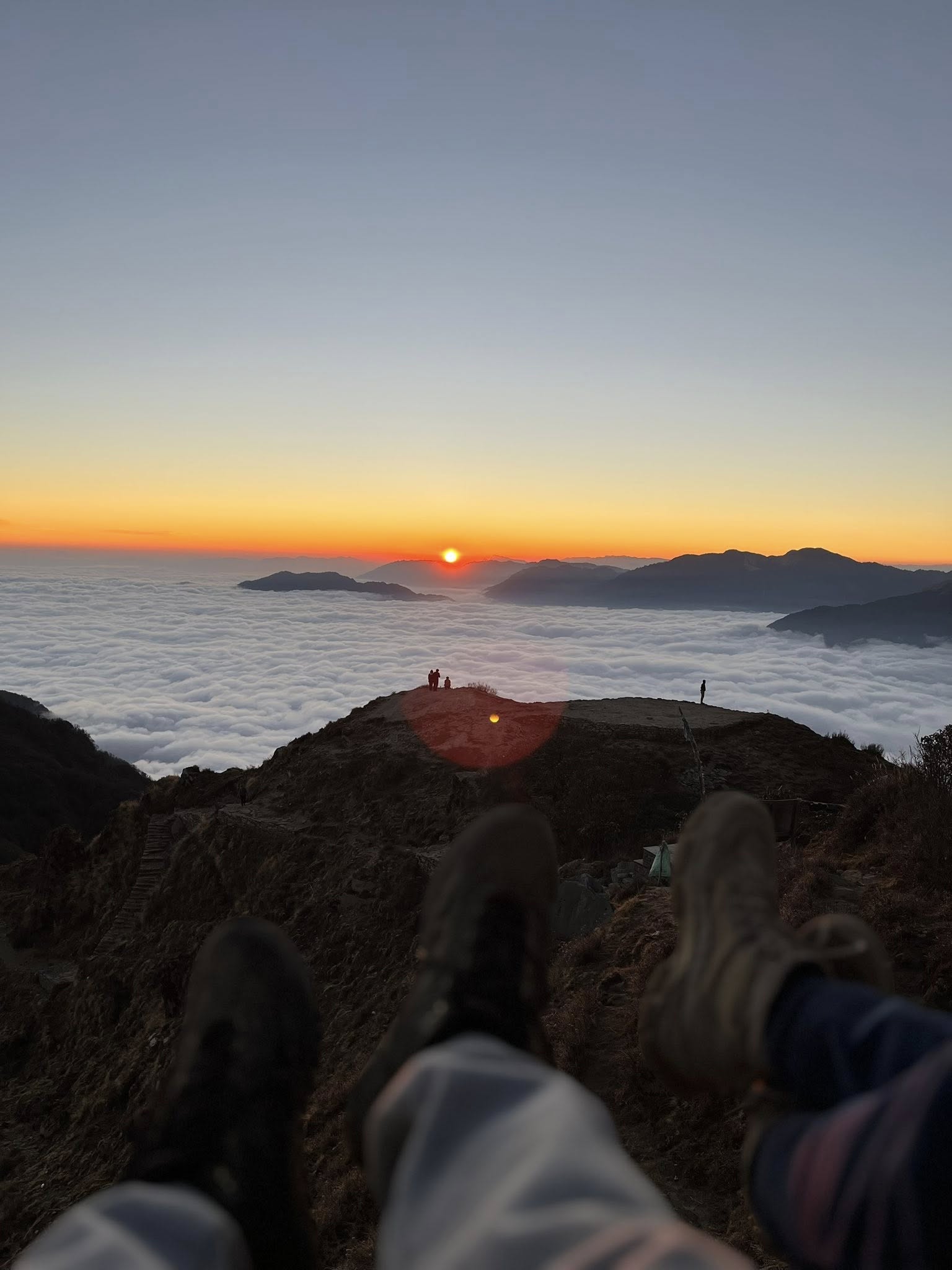 Sunrise over cloud inversion viewed from High Camp during the Mardi Himal Base Camp 5 Day Trek From Pokhara in Nepal’s Annapurna Himalayas.