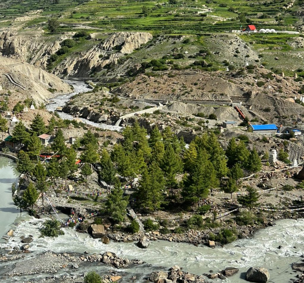Panoramic landscape from Chongkor Viewpoint showing the Marsyangdi River valley and terraced hills along the Annapurna Circuit.