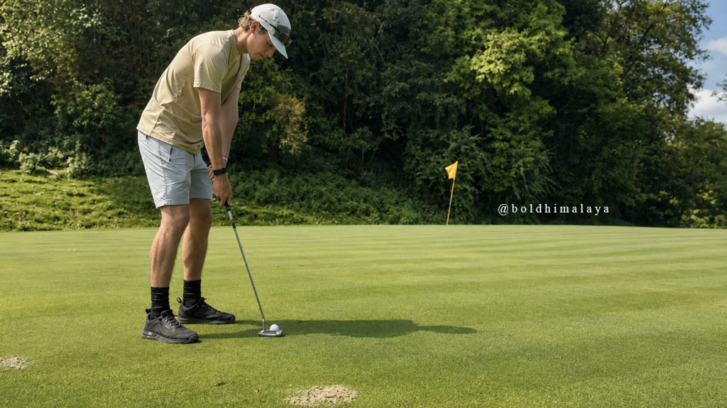 Golfer preparing to putt on a well-maintained golf course in Nepal