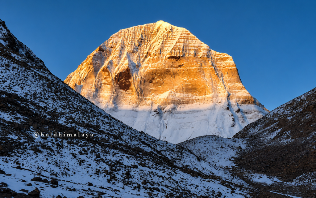 Golden sunlight illuminates the sacred peak of Mount Kailash.
