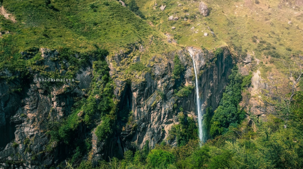 Waterfall cascading down a rocky cliff along the Manaslu Circuit Trek in monsoon