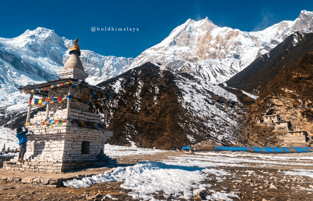 Majestic Manaslu Mountain rises above a small chorten, along the 11 Days Manaslu Circuit Trek