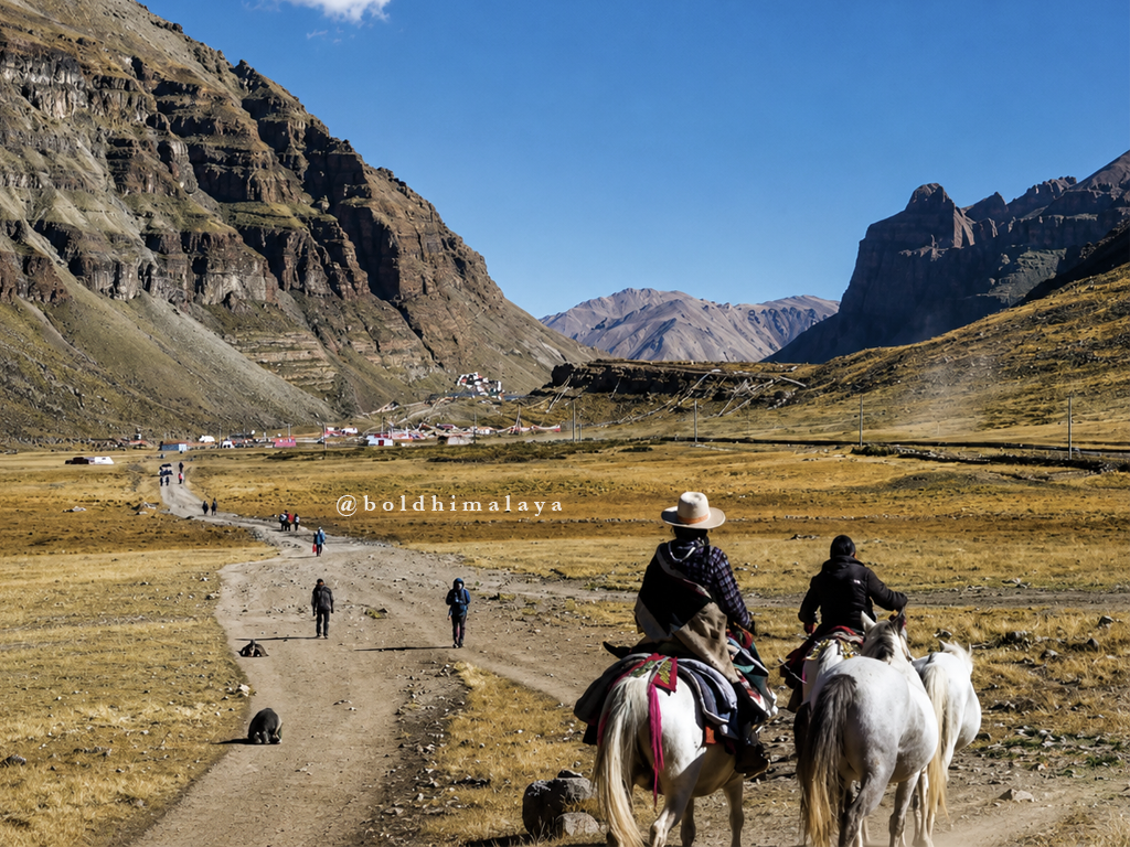 Pilgrims riding horses and trekking across the scenic valley during the Kailash Mansarovar Tour.
