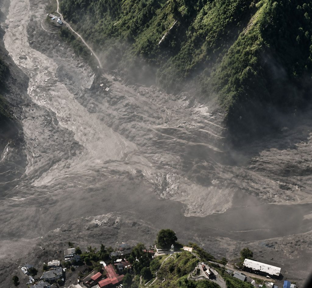 Rasuwa flood causing widespread debris and damage near settlements in Nepal.