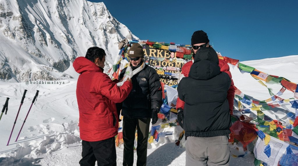 Trekkers with a guide at Larkya La Pass during MCT - Manaslu Circuit Trek Safety Guide