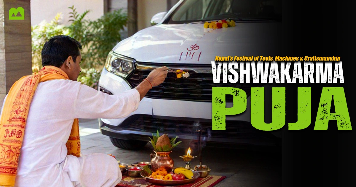 Person worshipping a vehicle during Vishwakarma Puja in Nepal.