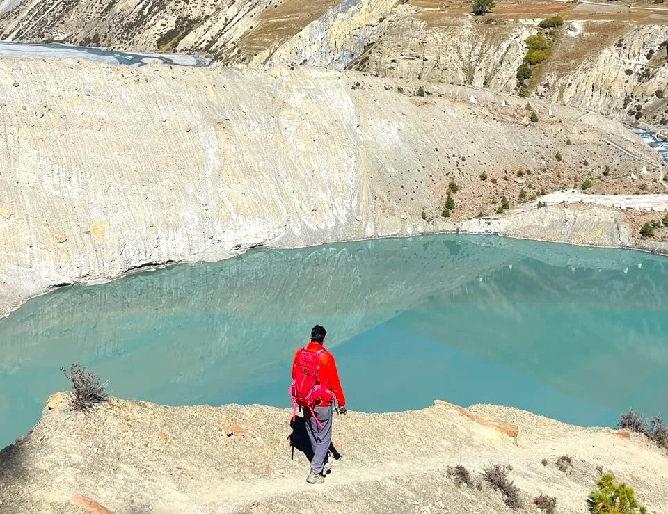 Gangapurna Lake surrounded by Himalayan mountains on the Annapurna Circuit Trek.